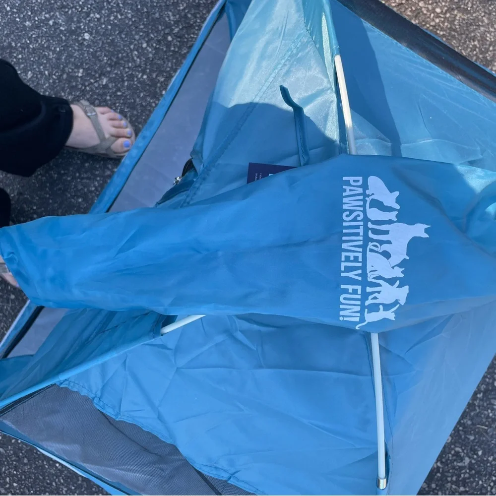 Here is a blue and gray pet tent. It’s very big and nice for an animal.
